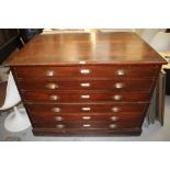 Early 20th century stained beech plan chest with six drawers and brass cup handles,