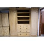 19th century pine inverted breakfront compactum wardrobe with shaped cornice and centred by pair of