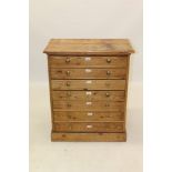 Late 19th century pine chest of seven drawers with brass knobs, on plinth base,