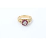Gold (18ct) diamond and ruby flower-head cluster ring.
