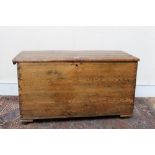 19th century pine coffer of slightly flared form and flanking rope carrying handles,