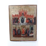 18th / 19th century Russian icon depicting Saints before a church, within gilt tooled border,