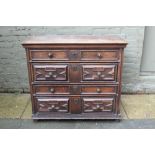 Late 17th century oak geometric chest with four mitre moulded drawers, on stiles,