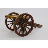 Good quality modern model brass field gun on wooden carriage, with accessories,