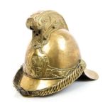 Early 20th century brass firemens' helmet with embossed dragon decoration to comb,