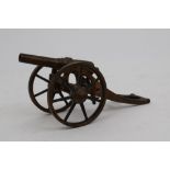 Good quality 19th century gilt brass model field gun on carriage,