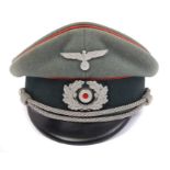 Second World War Nazi Artillery Officers' peaked cap with red piping - complete with badges and