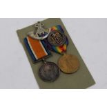 First World War pair - comprising War and Victory medals, together with silver War badge,