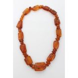 Old amber bead necklace - consisting of faceted and polished beads, 23.