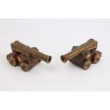 Pair of decorative brass and mahogany cannons,