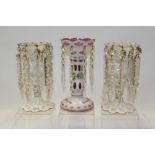 Pair of 19th century overlaid glass lustres with prismatic drops and one other similar (3)