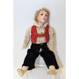 Doll - German boy - traditional clothing - bisque head, whistling mouth, head turns with metal rod,
