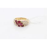 Gold (18ct) ruby and diamond set three band ring.