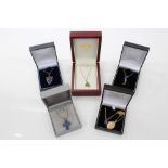 Group of six gold and gem set pendants on chains - to include Lalique glass cross pendant