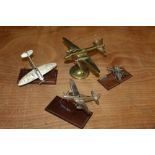 Three silver model aeroplanes and a brass model aeroplane (4)