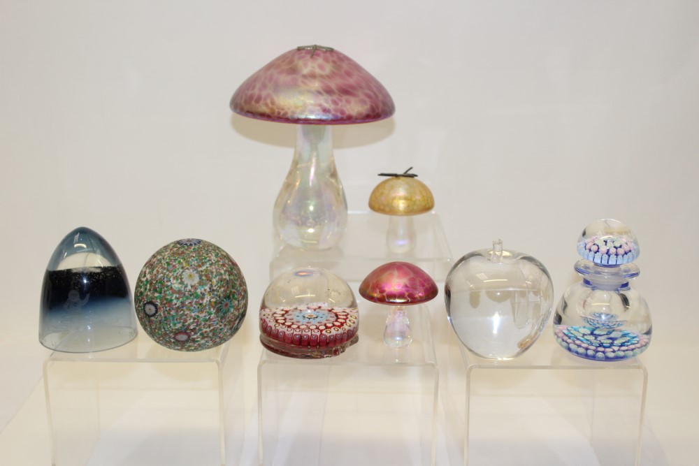 Group of eight paperweights including iridescent and millifiori