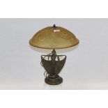 Art Deco-style table lamp with amber tinted glass shade,