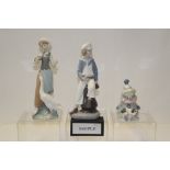 Eight Lladro porcelain figures and animals including lady feeding goose, clown with dog on its lap,