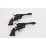 Pair of model revolvers with working actions, stamped on barrels - 'Single Action Mod.