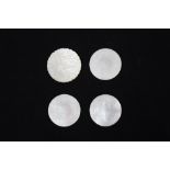 Four circular mother of pearl Chinese gaming counters with figural scenes