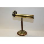 Unusual brass kaleidoscope on mahogany and brass stand,