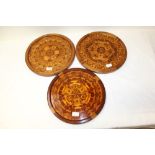 Set of three wall hanging circular inlaid marquetry plaques with intricate geometric decoration, 35.