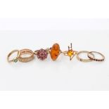 Group of seven gold gem set dress rings