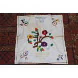 Folk Art embroidered fabric square, stylised flowers in colour thread,