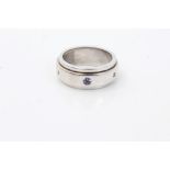 White gold (stamped 750) rotating band ring,