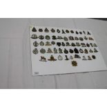 Collection of fifty-eight British Military cap badges,