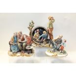 Three Capodimonte figure groups - including elderly couple on a sofa