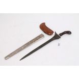 19th century kris with watered steel blade in white metal mounted scabbard