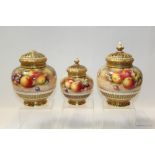 Three Royal Worcester porcelain pot pourri vases with covers,