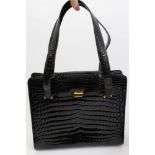 Kwanpen black genuine crocodile skin handbag with gilt metal fastenings