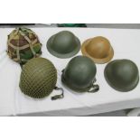 Collection of six various military helmets