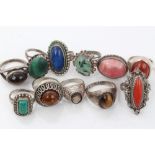 Collection of eleven silver / white metal rings set with various stones