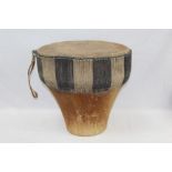 African tribal drum with animal skin covering,