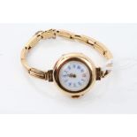 Yellow metal wristwatch with white enamel dial on gold (18ct) bracelet CONDITION REPORT