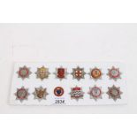 Card mounted with twelve various Fire Service badges - including rare Kings Crown 'Ministry of