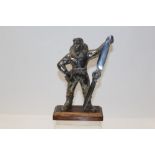 1940s silver plated novelty table lighter in the form of a fighter pilot holding a propeller,