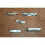 Three Victorian silver folding fruit knives with mother of pearl scales,