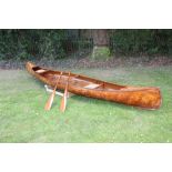 Good vintage Canadian canoe of large elegant form with twin rush seats,