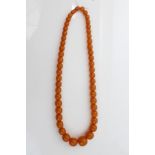 Amber bead necklace (possibly reconstituted) with graduated spherical beads CONDITION