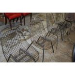 Pair of Eames design DKR steel wire dining chairs with lattice seat on wire supports,