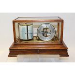 Rare Edwardian barograph with circular silvered dial, in a mahogany case with integral chart drawer,