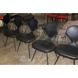 Set of six Eames design steel wire dining chairs, each with lattice back,