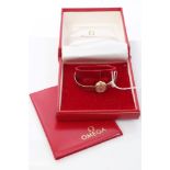 1960s ladies' gold (9ct) Omega wristwatch on gold (9ct) bracelet, in original box,