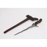 19th century kris with ornately carved hilt and scabbard