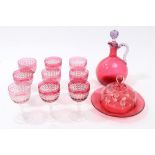 Set of nine Victorian cut cranberry overlaid glass wines with facet cut stems on star cut foot,