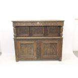 17th century-style carved oak court cupboard with relief carved scrolling foliate frieze,